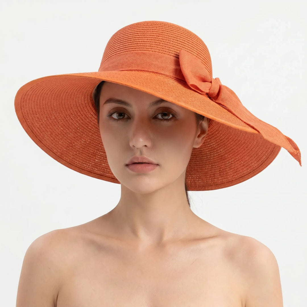 Travel-friendly women's wide brim sun hat, foldable for beach vacations. Enhance your summer style & sun protection.