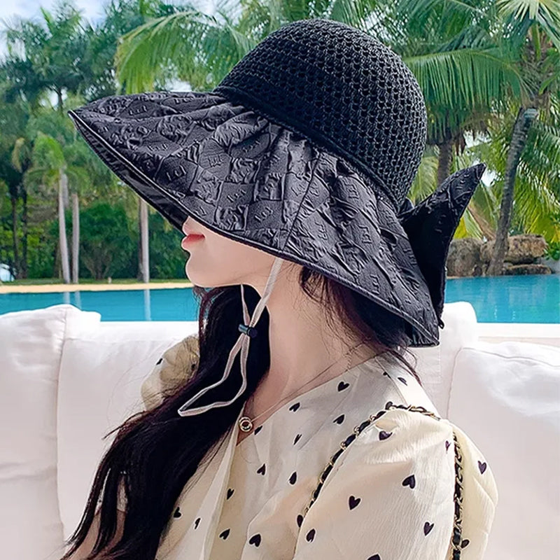 Women's uv protection sun hat, foldable and wide-brimmed, featuring a stylish bow element.