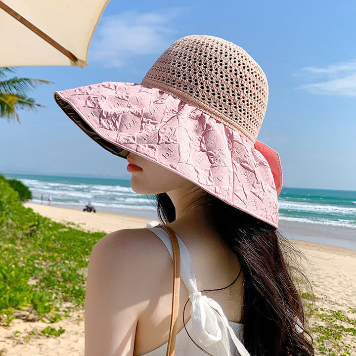 Women's summer hat, foldable wide-brim design with a prominent bow, ready for sunny adventures.