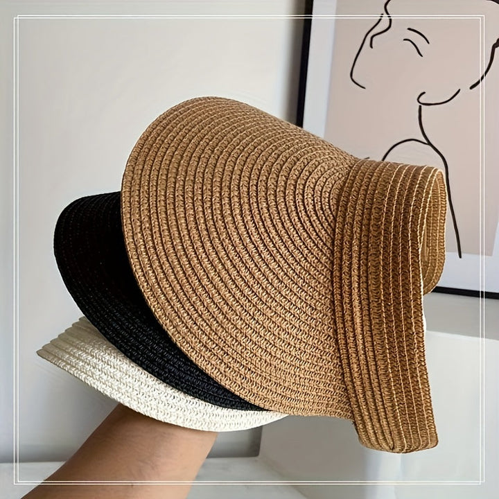 Women's foldable wide brim sun visor, ideal for beach, travel, and effective UV protection. A summer accessory.