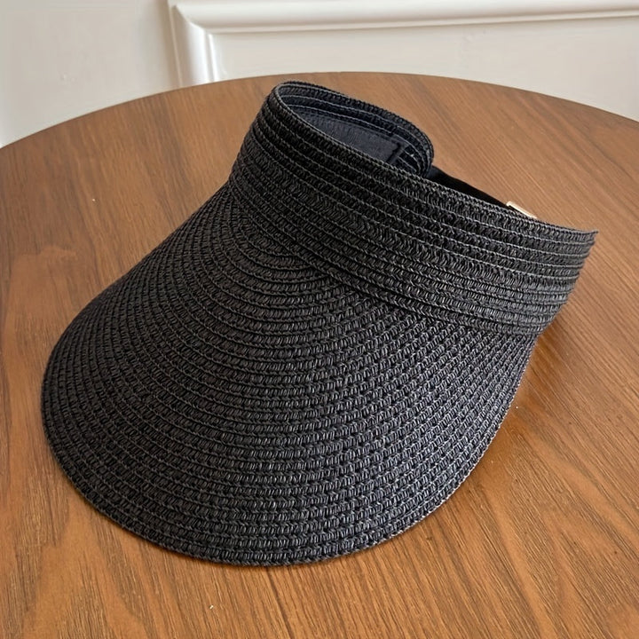 Natural straw women's foldable wide brim sun visor, a versatile summer hat & essential UV protection accessory.