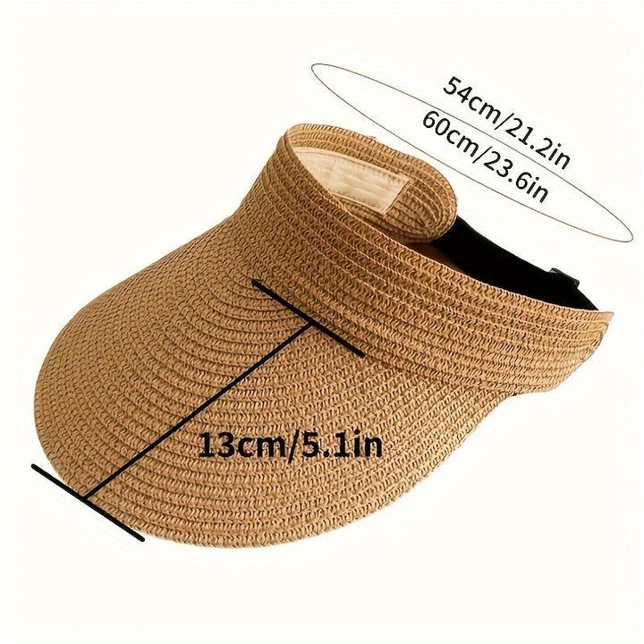 Woman enjoying the beach in her wide brim sun visor, providing crucial UV protection & stylish summer accessory.