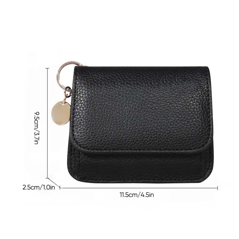 Women's leather mini coin purse held in hand, demonstrating its compact and convenient size.