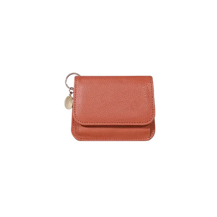 Assortment of genuine leather mini coin purses in various colors, showcasing options for women.