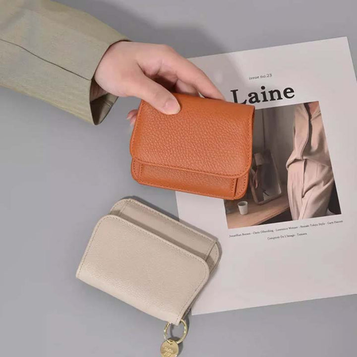 Small and practical women's leather coin purse, great for organizing loose change and small items.