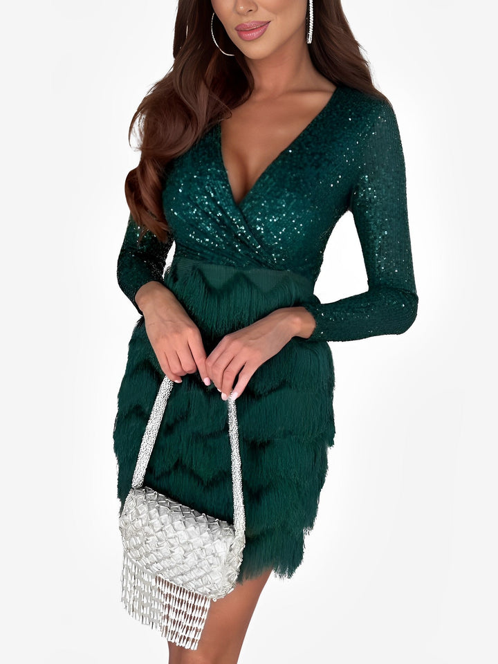 Shimmering long sleeve sequin fringe wrap mini dress, great for evening wear & dancing.