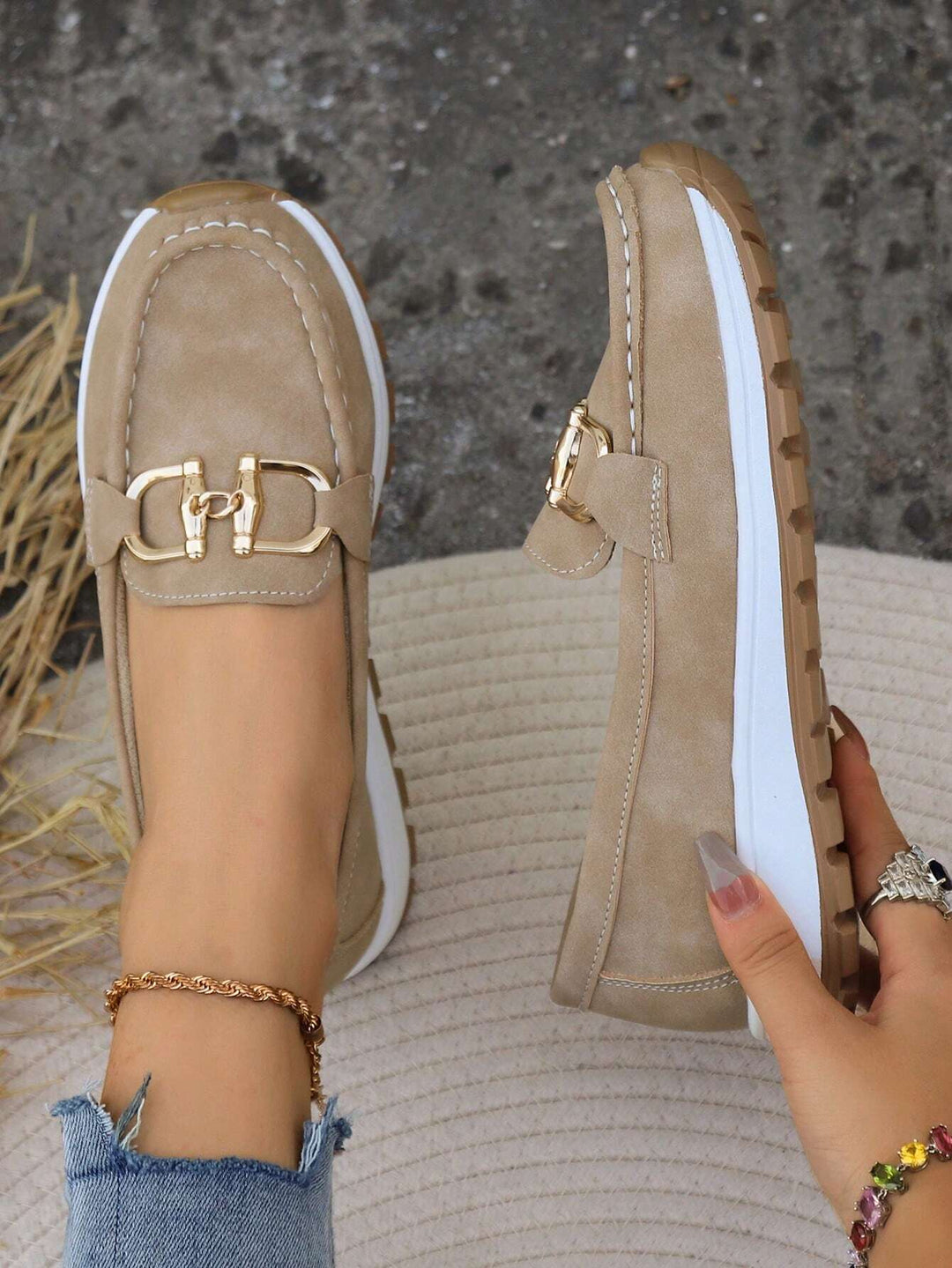 Comfortable women's loafers with a shining gold buckle, great for slip-on casual and dress shoe needs.