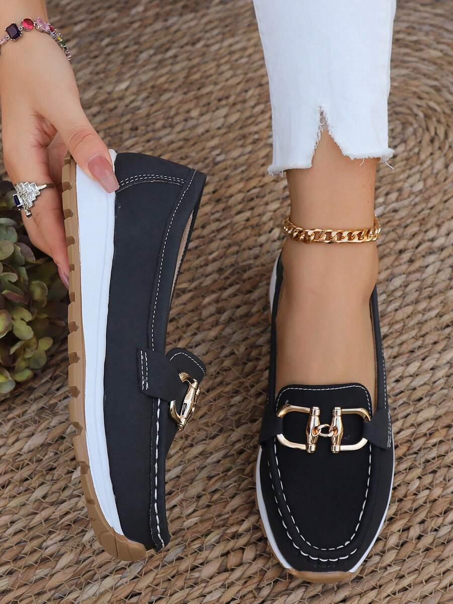 Navy women's horsebit loafers with gold trim, elegant and comfortable professional flats.
