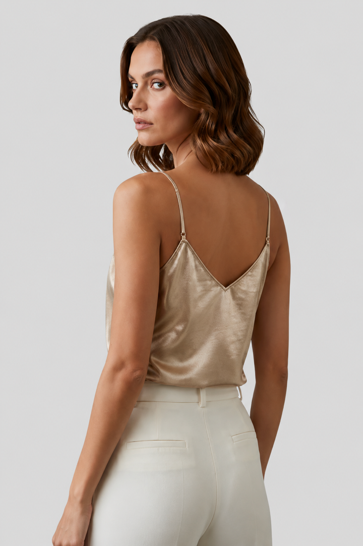 Versatile gold women's tank top with a V-neck and thin straps, ideal for warm weather and chic outfits.
