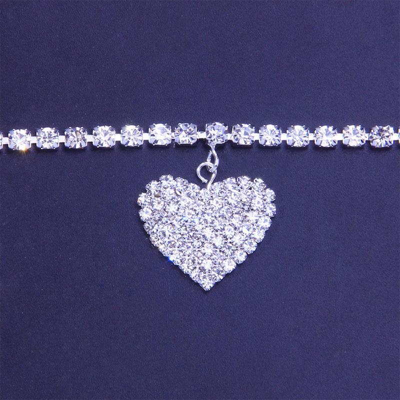 Stylish women's anklet featuring a rhinestone heart charm, available in golden, silver, and copper.
