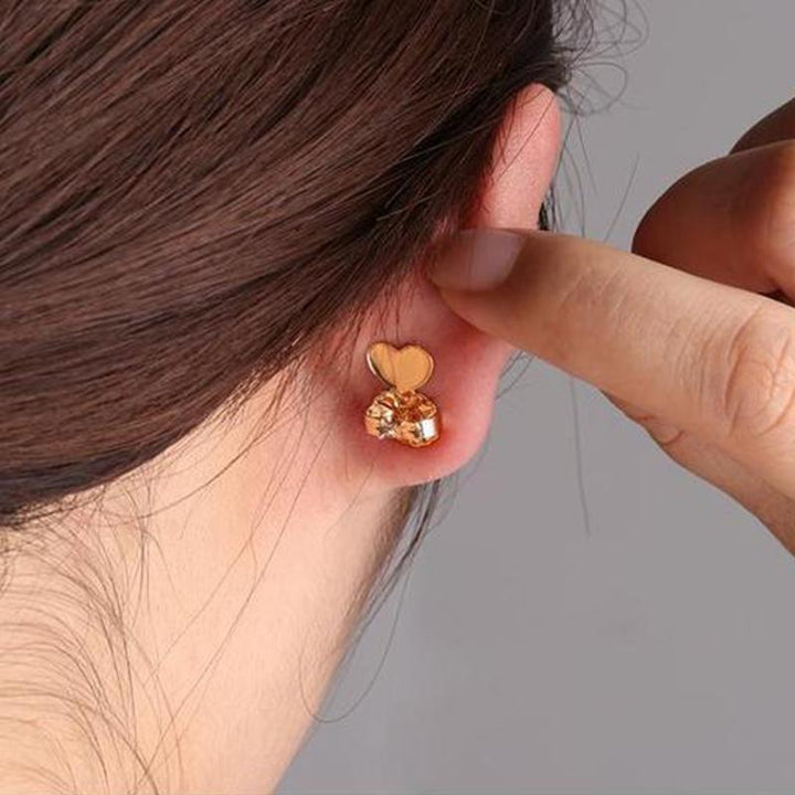 Silver instant earring lifters for women, secure jewelry backs providing support, elegant accessory.