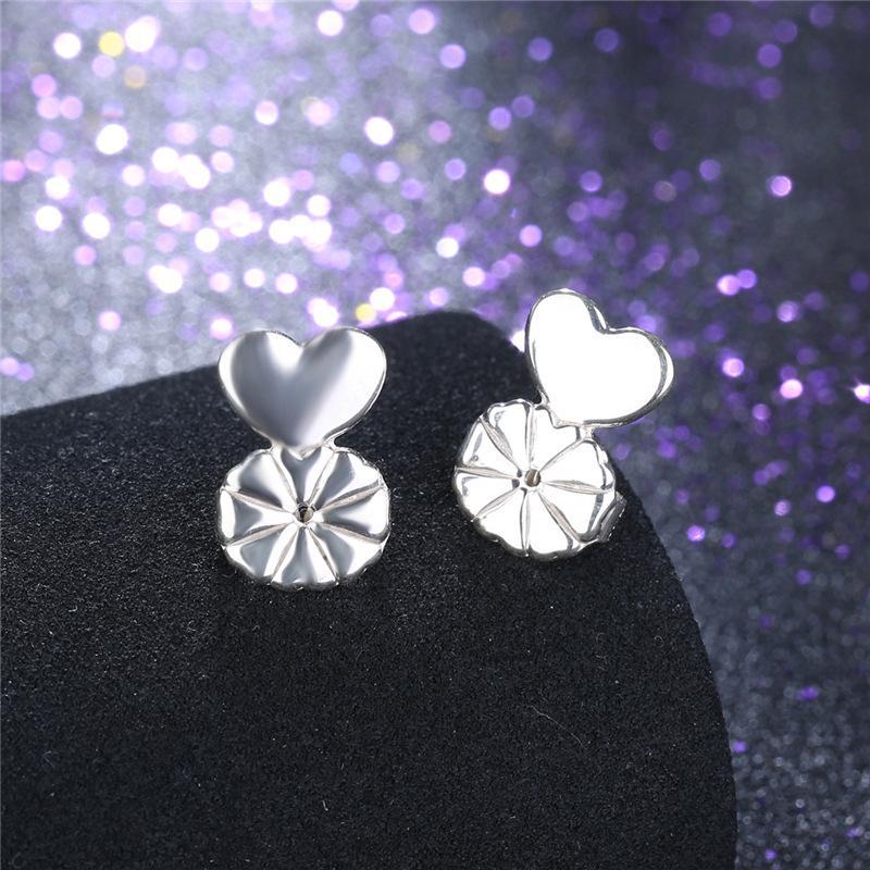 Close-up of golden earring lifter and back, designed for instant earlobe support, hypoallergenic jewelry.