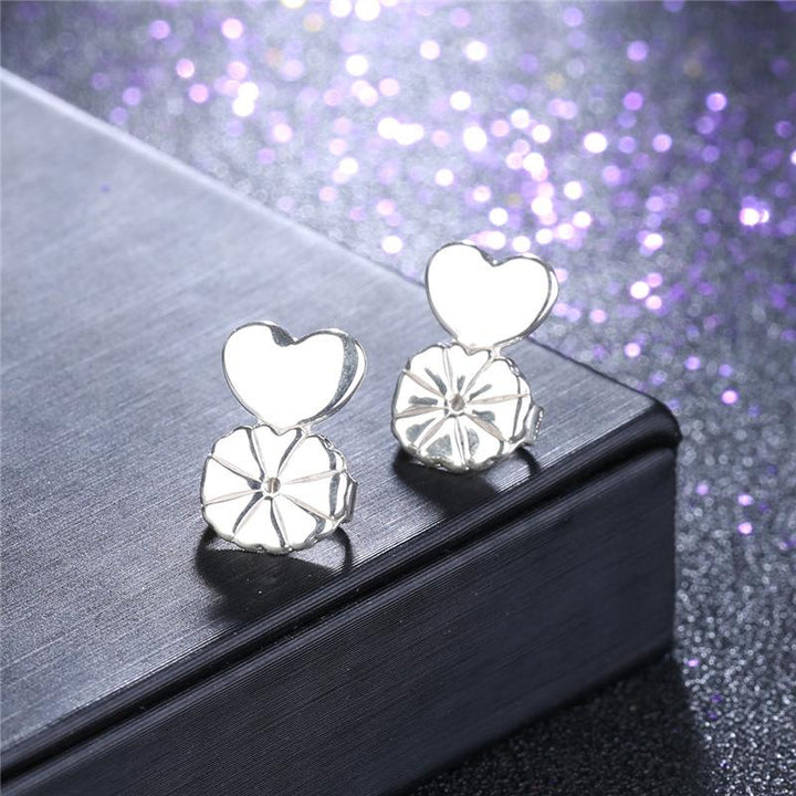 Pair of silver earring backs & lifters, essential jewelry accessories for comfortable earring wear and support.