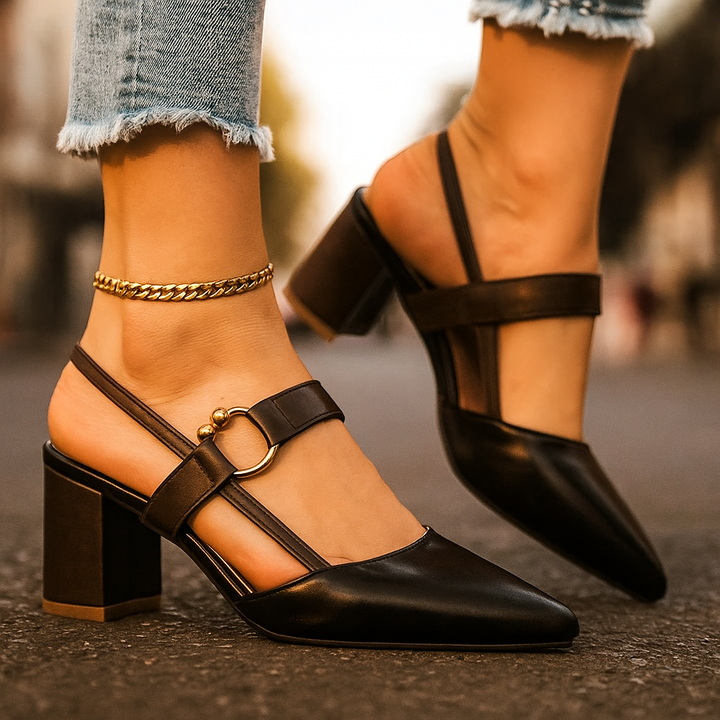 Elegant women's block heels with golden ring detail, black leather dress shoes for special events.