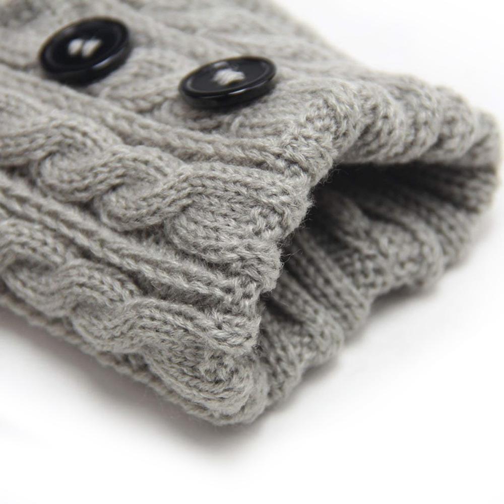 Close-up of a women's knit boot topper in navy, showcasing textured knit and buttons