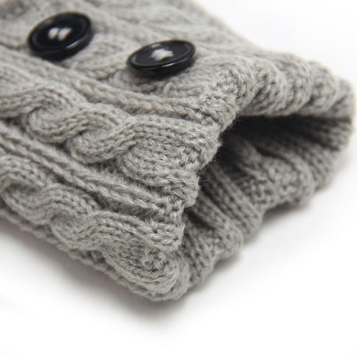Close-up of a women's knit boot topper in navy, showcasing textured knit and buttons
