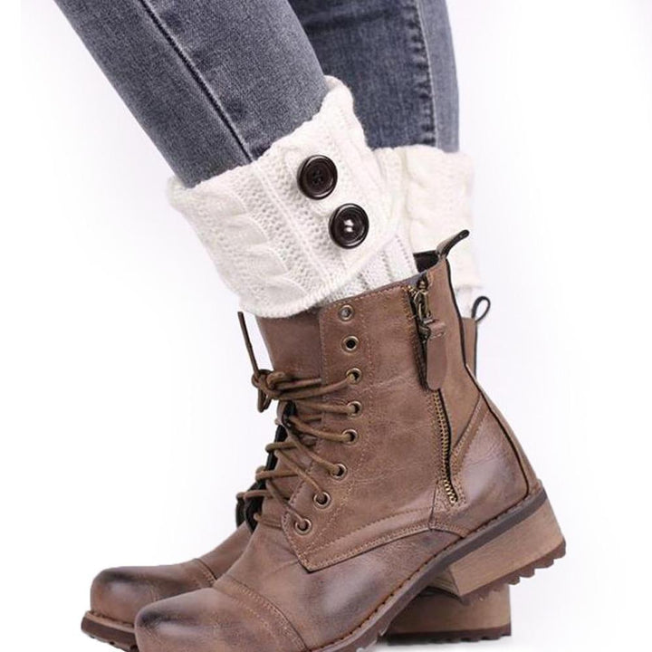 Collection of women's knit boot toppers in various colors (black, grey, cream) with buttons