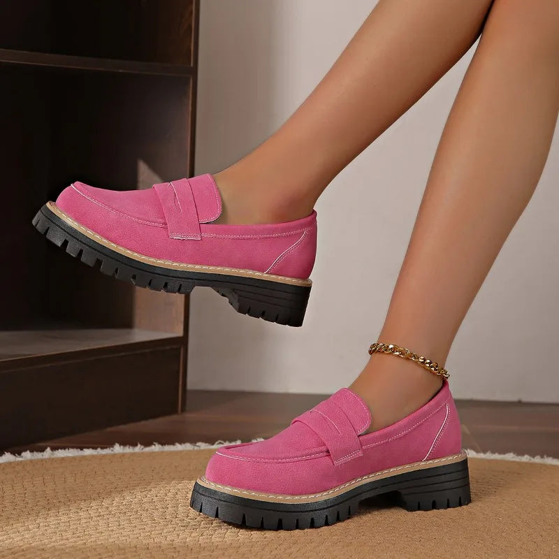 Women's green loafers with platform sole, emphasizing comfort and style
