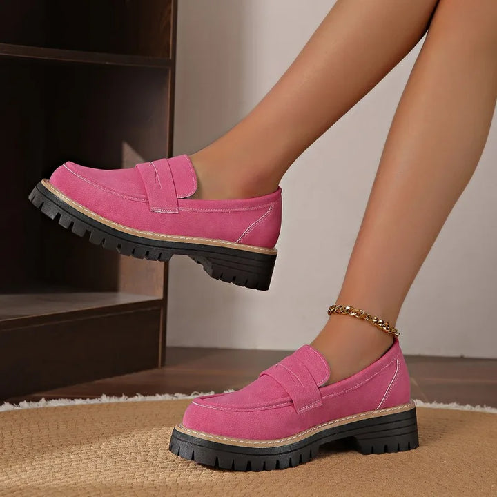 Women's green loafers with platform sole, emphasizing comfort and style