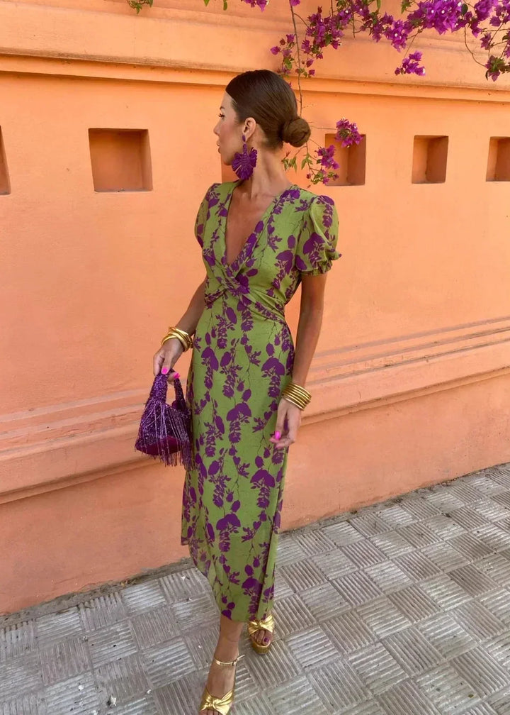 Elegant women's floral midi dress, a green wrap V-neck style with puff sleeves, ideal for special occasions or vacation.