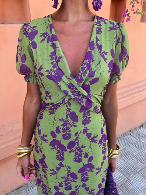 Boho chic women's floral maxi dress featuring a flattering wrap V-neck & flowy skirt, ideal for summer.