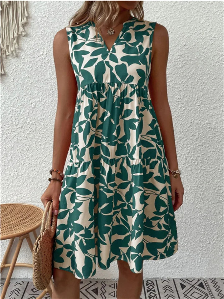 Women's green leaf print V-neck mini dress, ideal for summer. Sleeveless, casual & elegant vacation style.