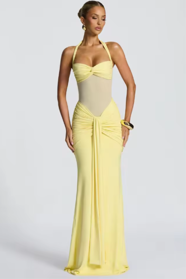 Flattering women's halter neck ruched bodycon maxi dress. Elegant formal evening wear and party gown.