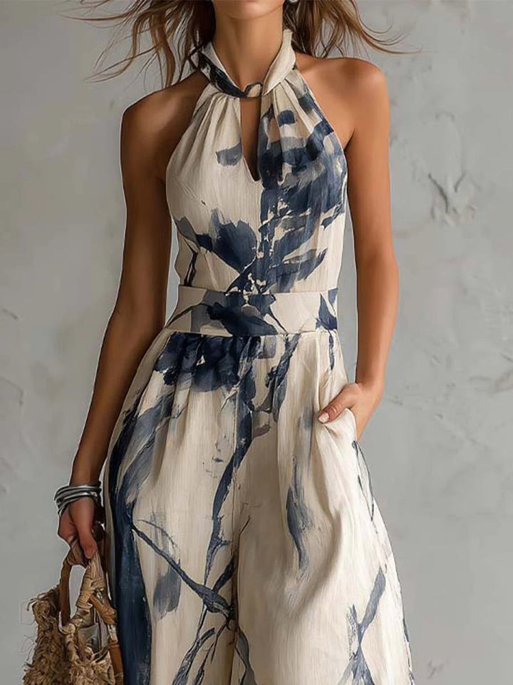 Stylish women's halter neck wide leg jumpsuit with an eye-catching abstract ink wash print. Elegant and comfy, with pockets.