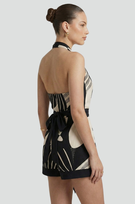 Comfortable women's halter mini wrap dress with a tie waist. Chic sleeveless design, flattering for all body types.
