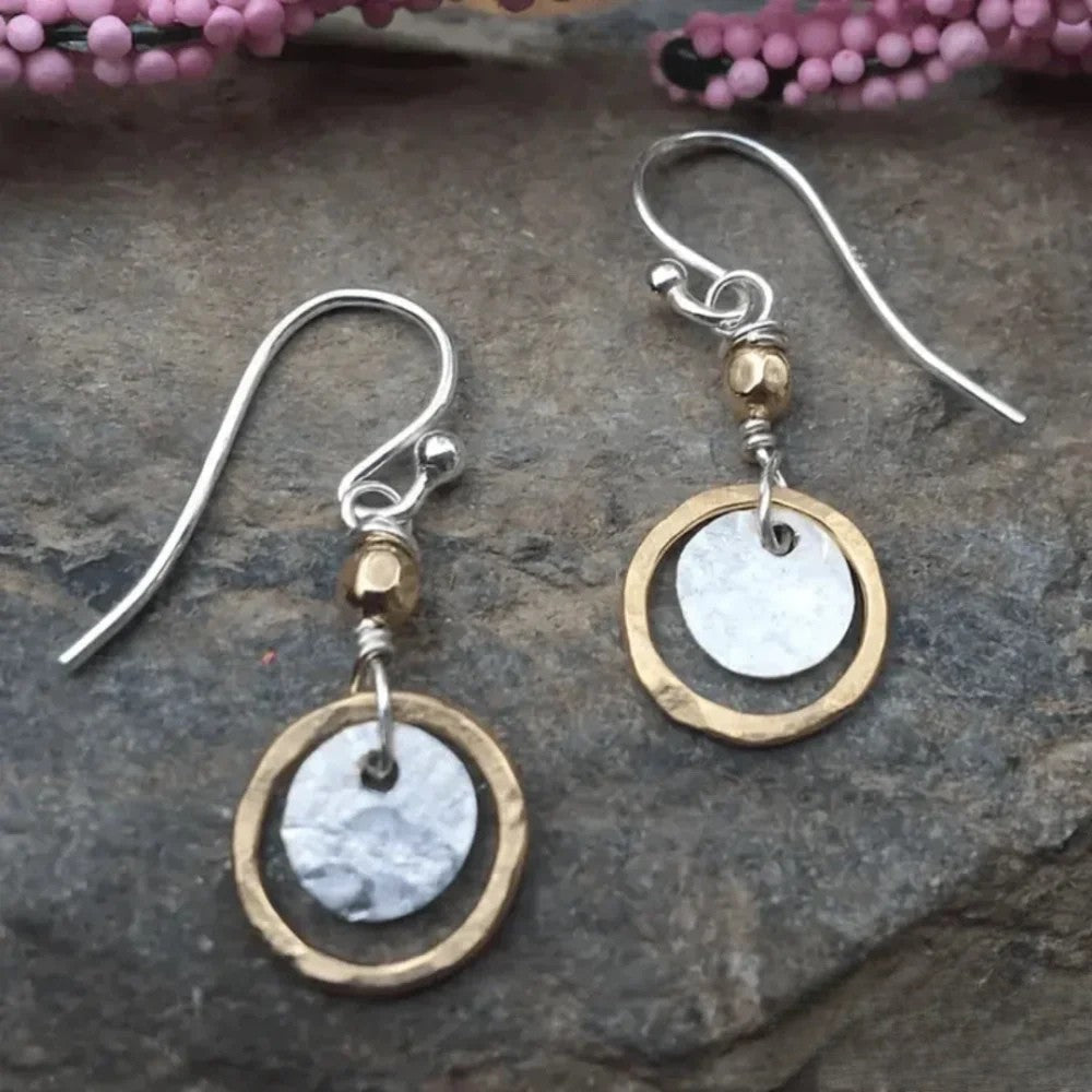 Women's hammered mixed metal drop earrings with silver & gold tone discs. Versatile, stylish jewelry.
