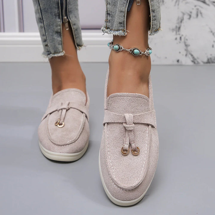 Pair of women's heather grey casual fabric slip-on loafers, comfort shoes