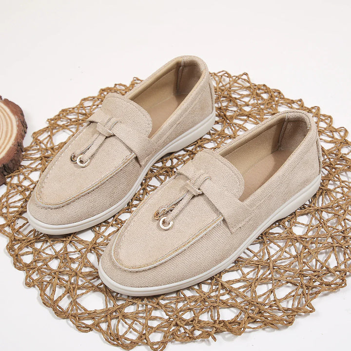 Side view of a women's heather grey fabric slip-on loafer, flat comfort shoe