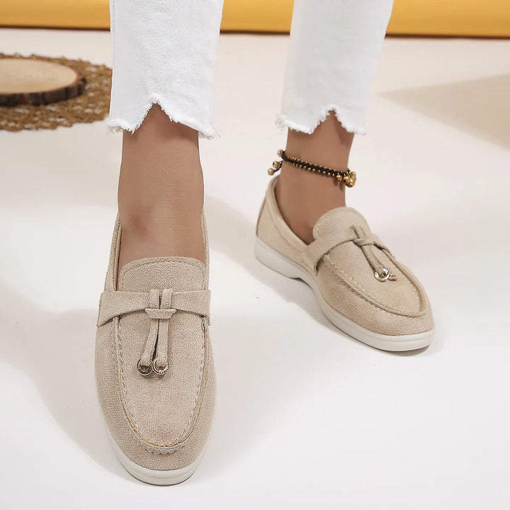 Detail of the comfortable sole on women's light khaki fabric slip-on loafers