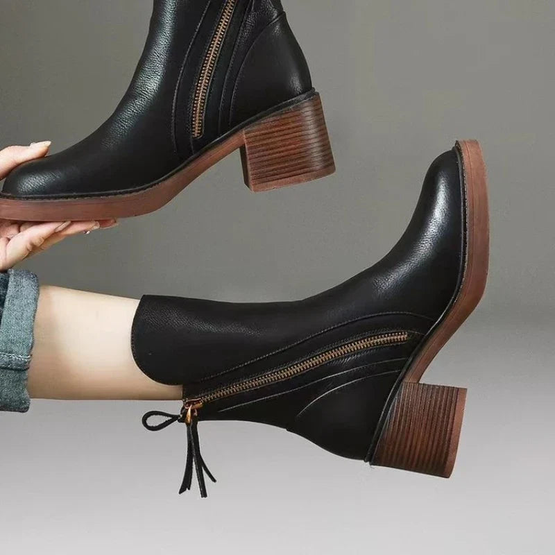 Dressy women's high heel ankle boots featuring zipper access & a shock-absorbing comfortable sole.