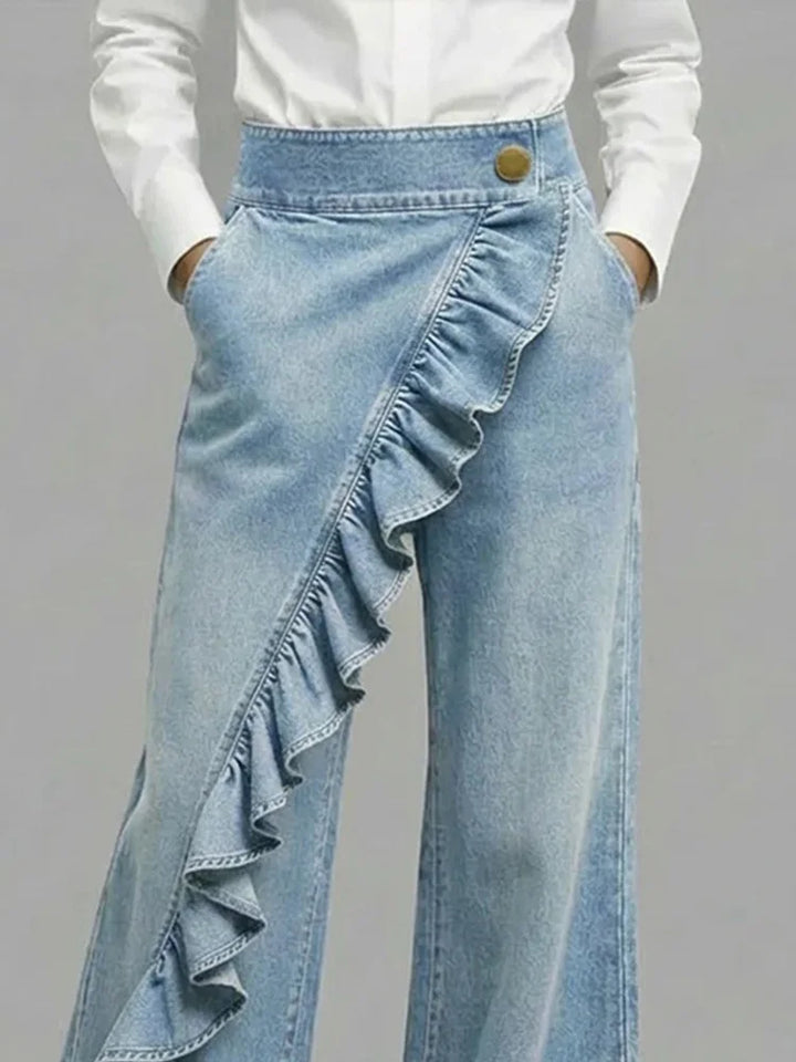 Black women's high rise wide leg jeans featuring chic ruffle accents. Modern, comfortable and stylish.
