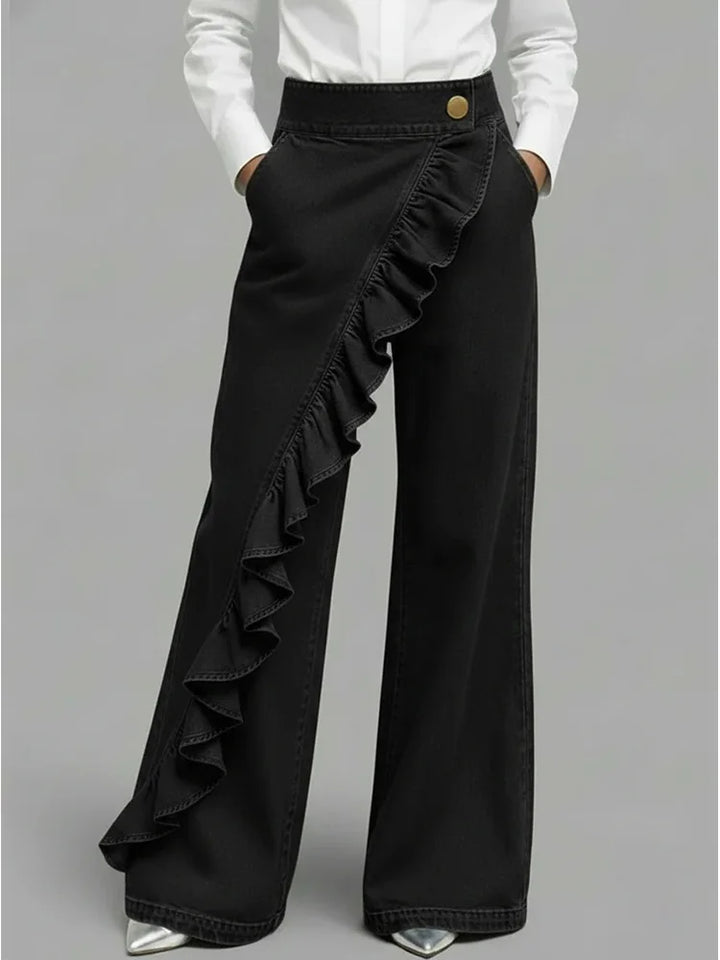 Fashionable women's wide leg high-rise jeans with statement ruffle detail. Perfect for a trendy look.