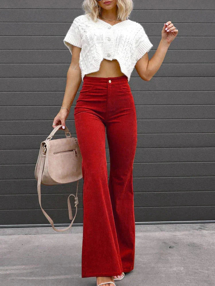 Women's work-appropriate high-waist flare trousers in black, featuring practical pockets.