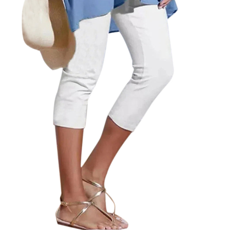 Side view of women's athletic high waist knee-length leggings, showing a flattering fit