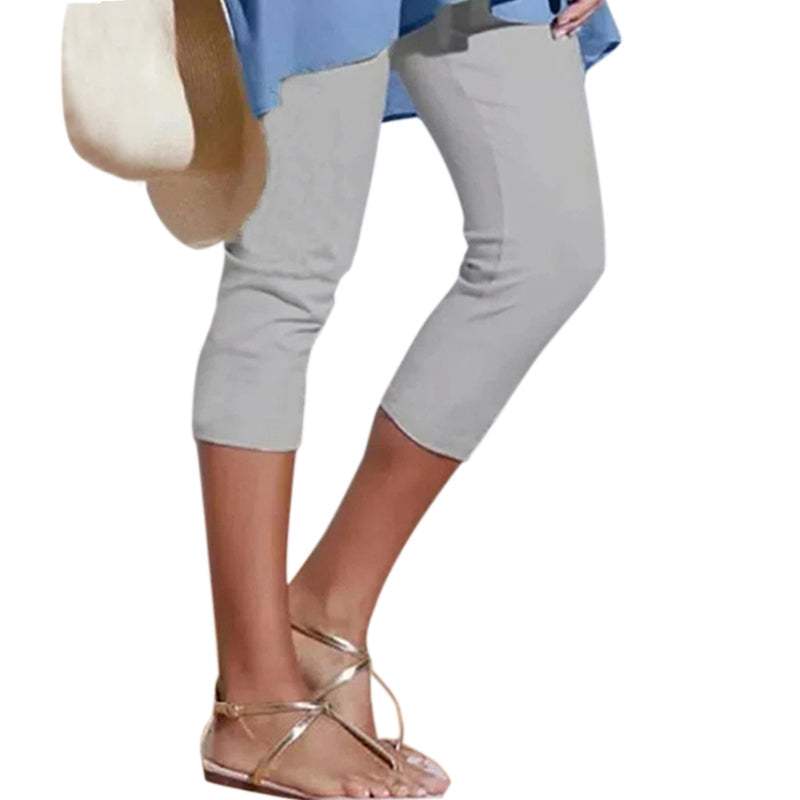 Detail of the high waistband on women's buttery soft knee-length leggings