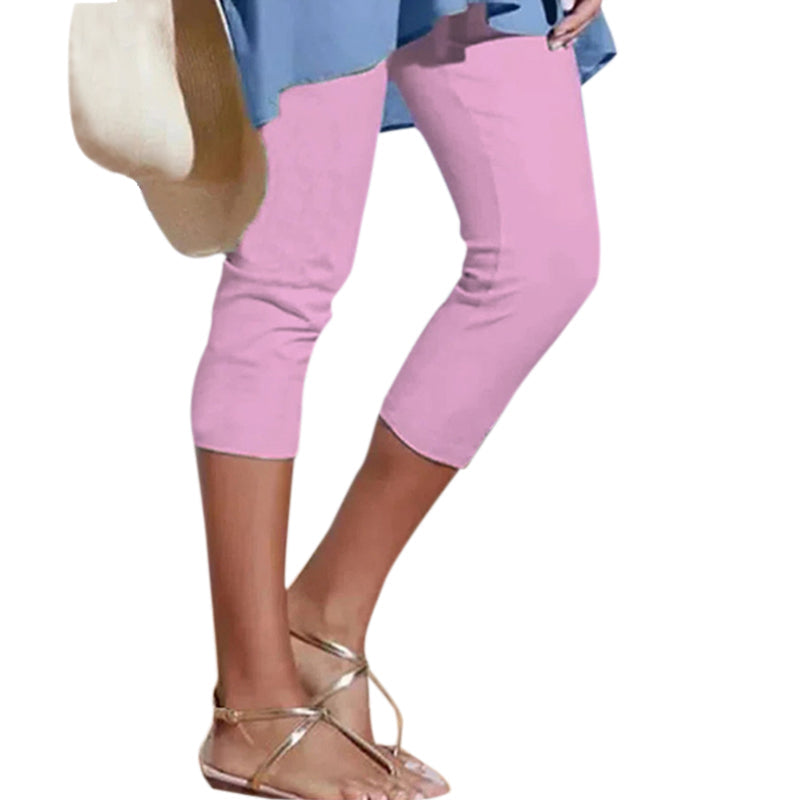 Pair of black women's knee-length high waist leggings laid flat, showcasing the design