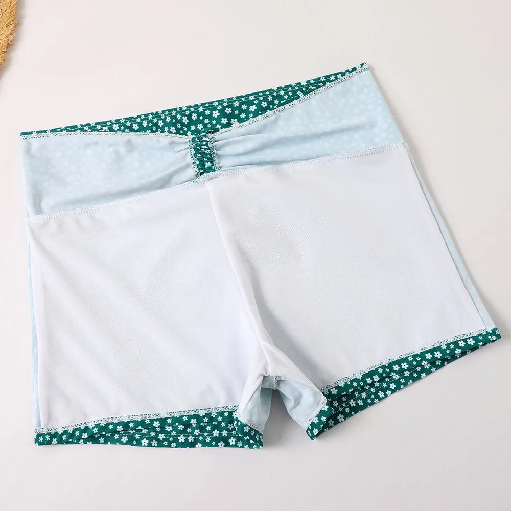 Flattering women's high-waist floral bikini set, supportive and trendy beach fashion.