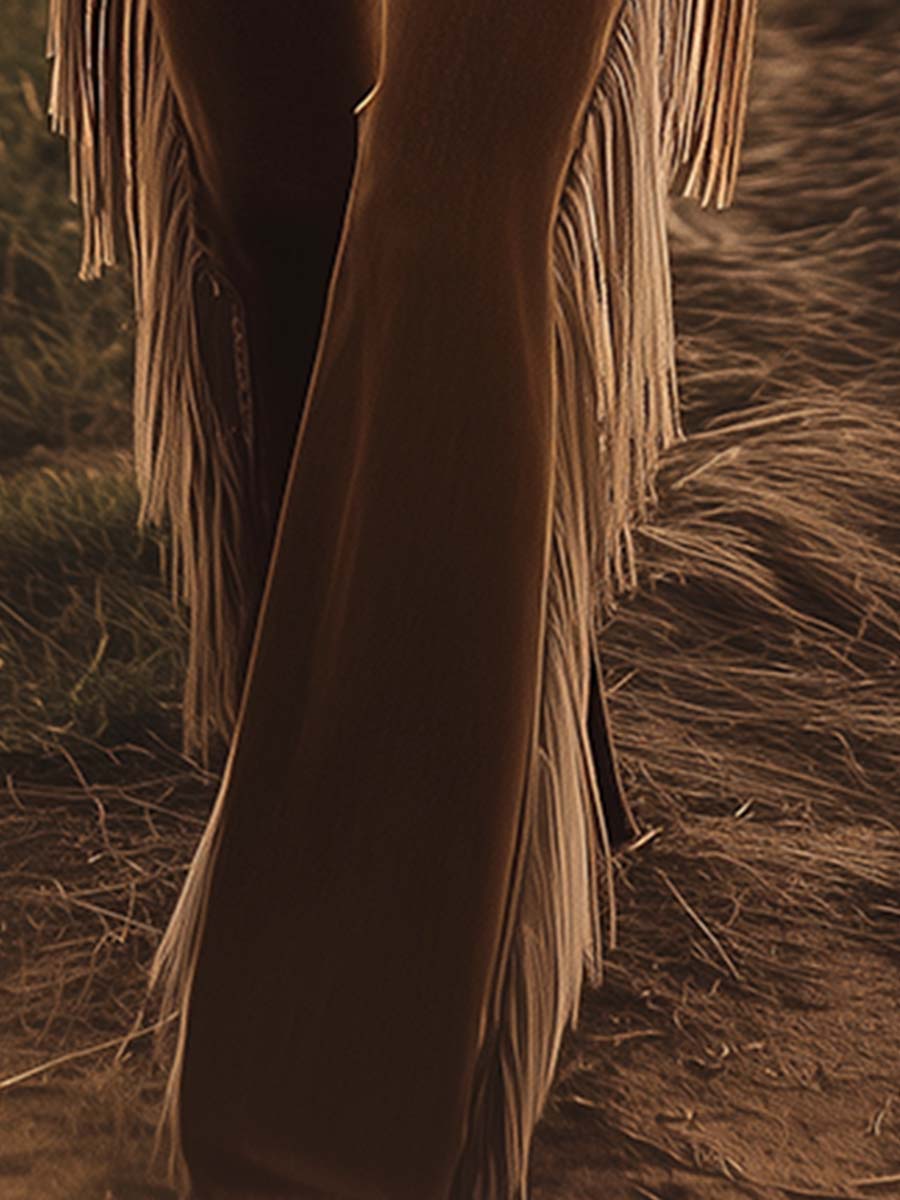 Boho festival ready: women's high waist flare jeans featuring playful fringe, embodying western country chic.