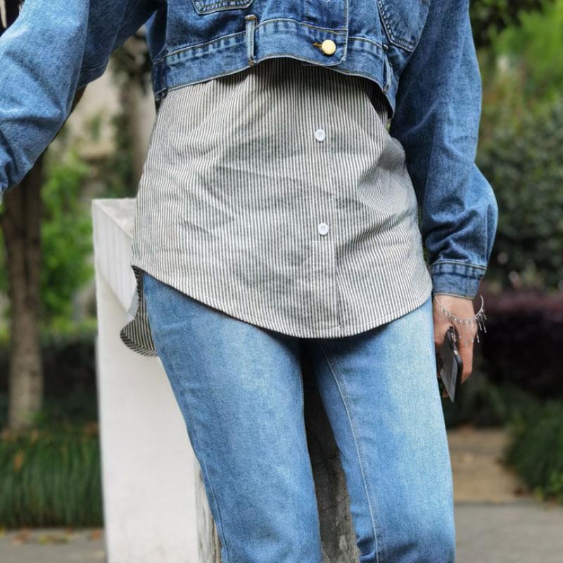 Close-up of fabric texture on a women's high waist fake hem layered skirt