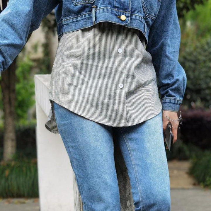 Close-up of fabric texture on a women's high waist fake hem layered skirt