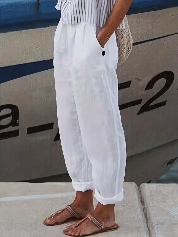 Women's high waist relaxed fit summer pants with stylish roll hem.