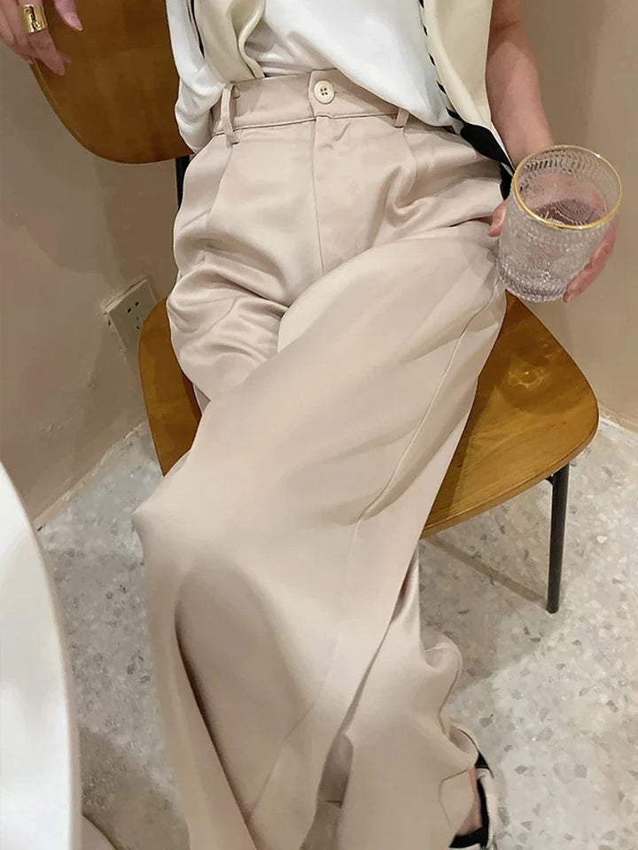 Effortless women's high waist wide leg pants, chic loose fit, versatile for summer looks.