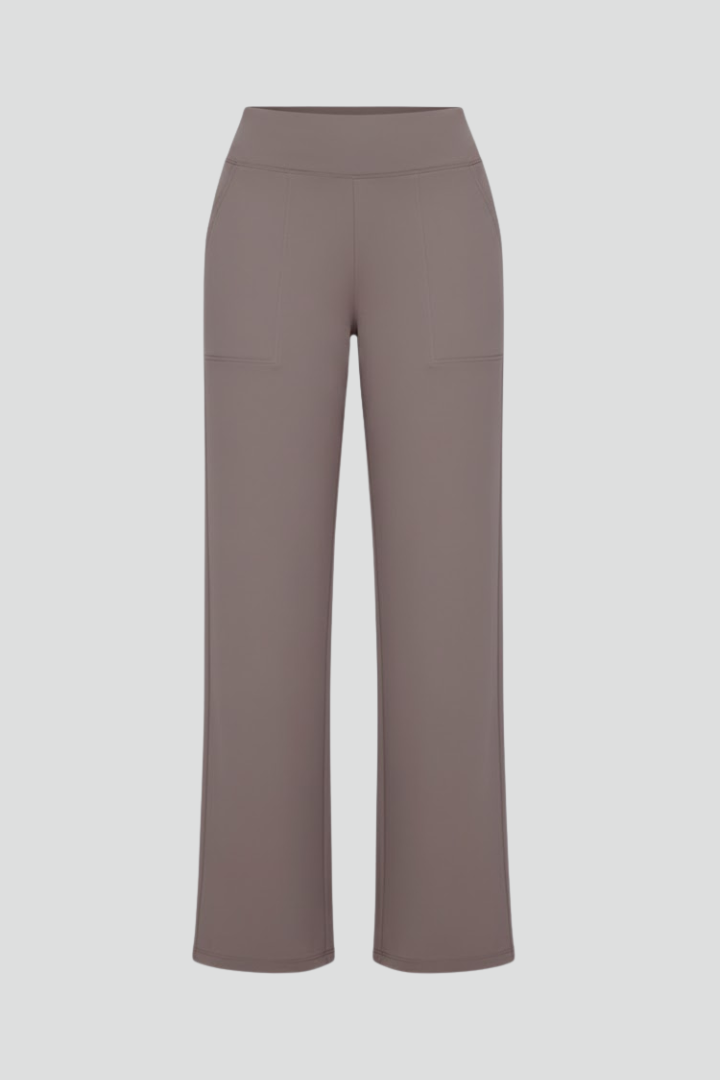 Women's high waist wide-leg trousers in solid color, featuring practical pockets for casual wear.
