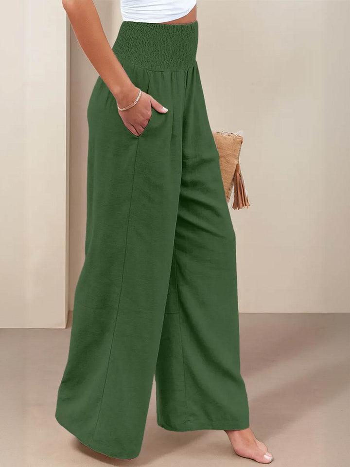 Women's relaxed fit high waist wide leg trousers, smocked waist for all-day comfort.