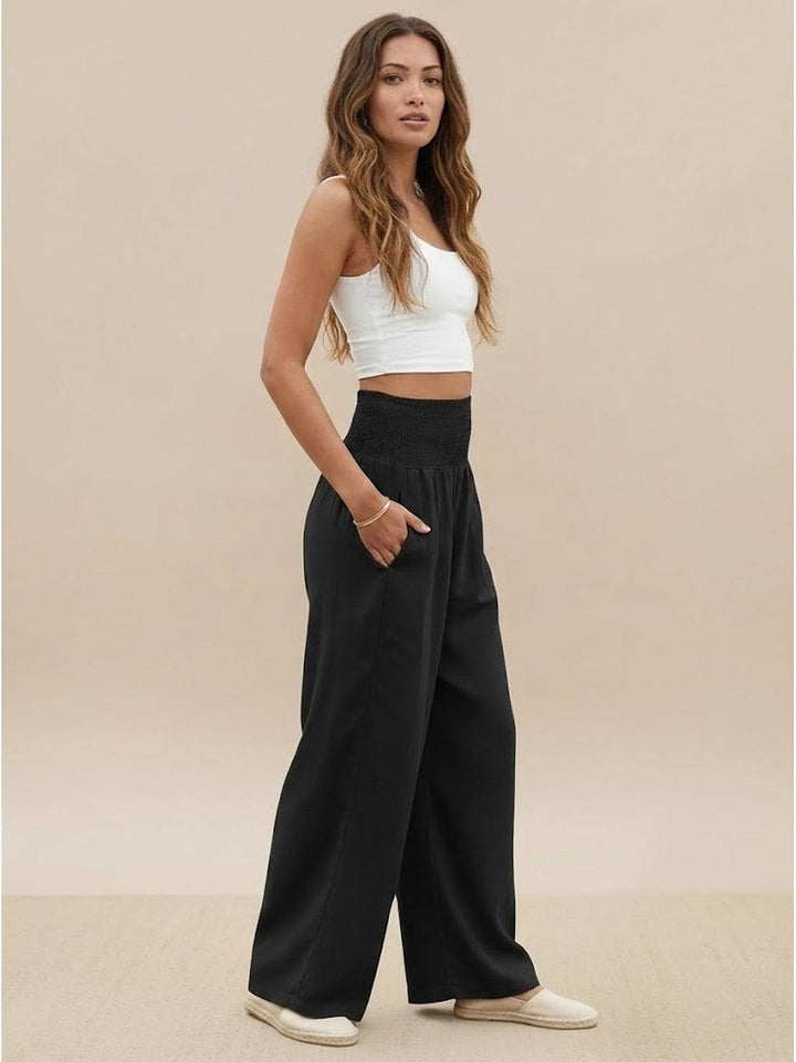 Chic women's wide leg pants, high smocked waist, perfect for versatile summer styling.