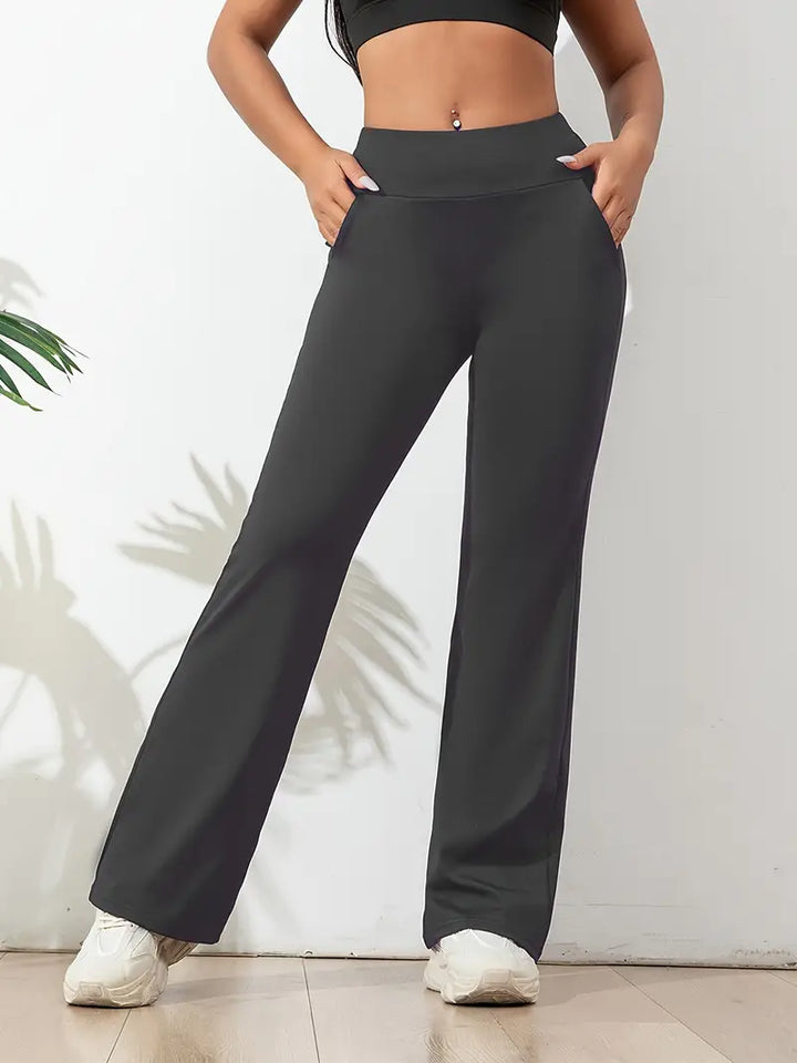 Black high-waisted flared activewear pants for women, super comfortable with a stretch fit for yoga & casual.